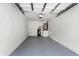 Spacious garage featuring a water heater, neutral paint, and ample room for parking and storage at 6856 Ebans Bend, Orlando, FL 32807