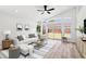 Stylishly staged living room featuring bright natural light and contemporary furnishings and decor at 6856 Ebans Bend, Orlando, FL 32807