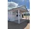 New construction shows covered patio with support columns and a view of the lot at 707 Junonia Blvd, New Smyrna Beach, FL 32168