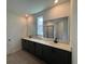 Elegant bathroom featuring dual vanities and modern fixtures at 707 Junonia Blvd, New Smyrna Beach, FL 32168
