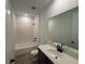 Well-lit bathroom with white subway tile and vanity sink at 707 Junonia Blvd, New Smyrna Beach, FL 32168