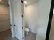 Bathroom featuring a toilet room adjacent to a closet and the walk-in shower with black trim at 707 Junonia Blvd, New Smyrna Beach, FL 32168
