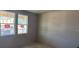 Bedroom with natural light, unfinished walls and concrete floors at 707 Junonia Blvd, New Smyrna Beach, FL 32168