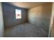 Unfinished bedroom with a window providing natural light at 707 Junonia Blvd, New Smyrna Beach, FL 32168