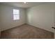 Neutral bedroom with a window that provides natural light at 707 Junonia Blvd, New Smyrna Beach, FL 32168