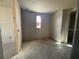 Unfinished bedroom showcasing a window and room's layout at 707 Junonia Blvd, New Smyrna Beach, FL 32168