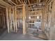 A new construction home displays the framework for a bathroom and additional rooms at 707 Junonia Blvd, New Smyrna Beach, FL 32168