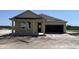 Charming one-story home featuring a covered porch and a two-car garage at 707 Junonia Blvd, New Smyrna Beach, FL 32168
