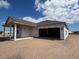 New construction showing covered back porch and framed garage awaiting to be completed at 707 Junonia Blvd, New Smyrna Beach, FL 32168
