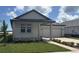 Charming single Gathering home with a two car garage and nicely manicured lawn at 707 Junonia Blvd, New Smyrna Beach, FL 32168