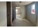 Unfinished hallway with ample natural light at 707 Junonia Blvd, New Smyrna Beach, FL 32168