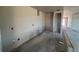 Spacious kitchen area with unfinished walls and concrete floors, perfect for customization at 707 Junonia Blvd, New Smyrna Beach, FL 32168