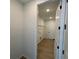 Practical laundry room featuring shelving and utility connections at 707 Junonia Blvd, New Smyrna Beach, FL 32168
