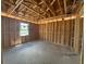 Living room framing with a window allowing in natural light and ceiling beams at 707 Junonia Blvd, New Smyrna Beach, FL 32168