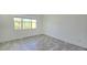 A bright bedroom with large windows providing ample natural light and neutral decor at 726 Coral Reef Way, Daytona Beach, FL 32124