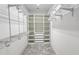 Walk-in closet featuring custom shelving and drawers for optimal storage and organization at 726 Coral Reef Way, Daytona Beach, FL 32124
