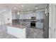 Open kitchen with granite countertops, stainless steel appliances, and gray cabinets at 726 Coral Reef Way, Daytona Beach, FL 32124