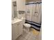 Cozy bathroom with shower curtain, tile flooring, and functional fixtures at 837 Pebble Creek Cir, Orlando, FL 32824