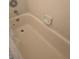 Close-up of a clean bathtub with tile surround and chrome fixtures at 837 Pebble Creek Cir, Orlando, FL 32824
