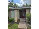Inviting home entrance with a neatly landscaped yard and visible house number at 837 Pebble Creek Cir, Orlando, FL 32824