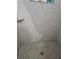 Close-up of a tiled shower with built-in soap dish and drain at 837 Pebble Creek Cir, Orlando, FL 32824