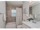 Classic bathroom with tiled tub/shower combination, single sink vanity, and neutral décor at 871 Orleans Dr, Eagle Lake, FL 33839