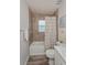 Simple bathroom featuring tiled tub/shower combination, with a decorative shower curtain at 871 Orleans Dr, Eagle Lake, FL 33839