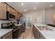 Well-equipped kitchen with stainless appliances, granite counters, and lots of cabinet storage at 871 Orleans Dr, Eagle Lake, FL 33839