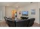 Bright living room with vaulted ceilings, plush seating and sleek entertainment center at 871 Orleans Dr, Eagle Lake, FL 33839