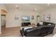 Open-concept living area with plush seating and a view into adjacent rooms at 871 Orleans Dr, Eagle Lake, FL 33839