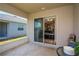 A covered patio with a sliding glass door to the home's interior at 871 Orleans Dr, Eagle Lake, FL 33839