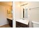 Well-lit bathroom with double sinks, vanity, and a shower at 984 Dinero Dr, Winter Springs, FL 32708