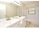 Bathroom with double sinks, white cabinets, tile floors, and shower-tub combo at 984 Dinero Dr, Winter Springs, FL 32708
