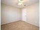 Bedroom featuring carpet, white door, and ceiling fan at 984 Dinero Dr, Winter Springs, FL 32708