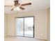 Cozy bedroom with a ceiling fan and sliding glass door access to the yard at 984 Dinero Dr, Winter Springs, FL 32708