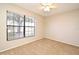 Cozy bedroom with carpet, large window and neutral paint at 984 Dinero Dr, Winter Springs, FL 32708
