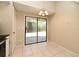 Bright dining area features tile floors, sliding glass doors, and a stylish chandelier at 984 Dinero Dr, Winter Springs, FL 32708