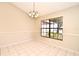 Bright dining room with tile flooring and a large window overlooking the yard at 984 Dinero Dr, Winter Springs, FL 32708