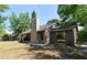 Cozy home exterior featuring a chimney, ample yard space, mature trees and natural light at 984 Dinero Dr, Winter Springs, FL 32708