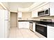 Bright kitchen with stainless steel appliances and white cabinetry at 984 Dinero Dr, Winter Springs, FL 32708