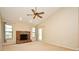 Inviting living room with a brick fireplace, neutral walls, and ample natural light at 984 Dinero Dr, Winter Springs, FL 32708