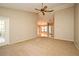 Spacious living room with neutral carpet, and a clear view to front entrance at 984 Dinero Dr, Winter Springs, FL 32708
