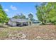 Spacious backyard with a covered patio, ideal for relaxation and enjoying the outdoors at 107 Hilltop Dr, Longwood, FL 32750