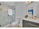 Modern bathroom featuring a marble shower, stylish vanity, and gold fixtures at 107 Hilltop Dr, Longwood, FL 32750
