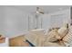 Bright bedroom features neutral tones, ceiling fan, and closet at 107 Hilltop Dr, Longwood, FL 32750