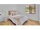 Comfortable bedroom featuring a cozy bed and a window that looks out onto the neighborhood at 107 Hilltop Dr, Longwood, FL 32750