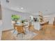 Bright dining area with wooden table, adjacent kitchen, and lots of natural light at 107 Hilltop Dr, Longwood, FL 32750