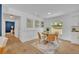 Cozy dining area with wooden table and stylish decor with lots of natural light at 107 Hilltop Dr, Longwood, FL 32750