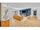 Sunlit living room with hardwood floors, modern fireplace, and neutral decor at 107 Hilltop Dr, Longwood, FL 32750