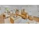 Open-concept living space featuring hardwood floors, contemporary decor, and bright lighting at 107 Hilltop Dr, Longwood, FL 32750